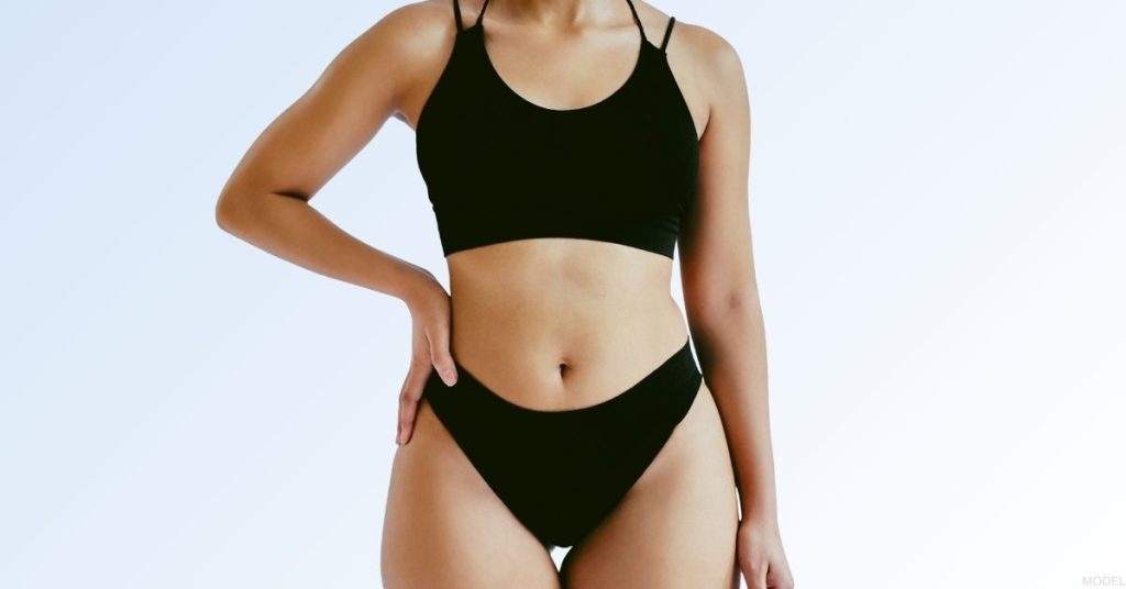Woman in a black bikini. (Model)